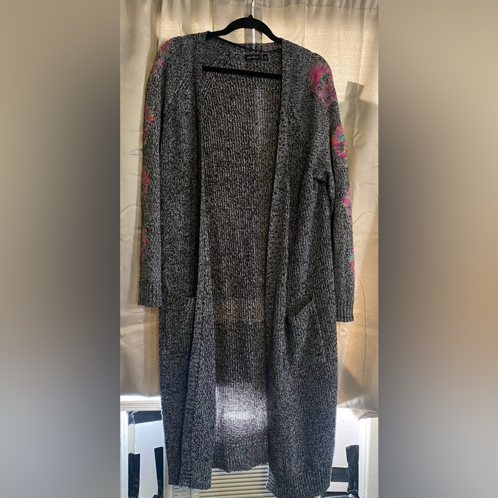 Long gray sweater with skulls on sleeve